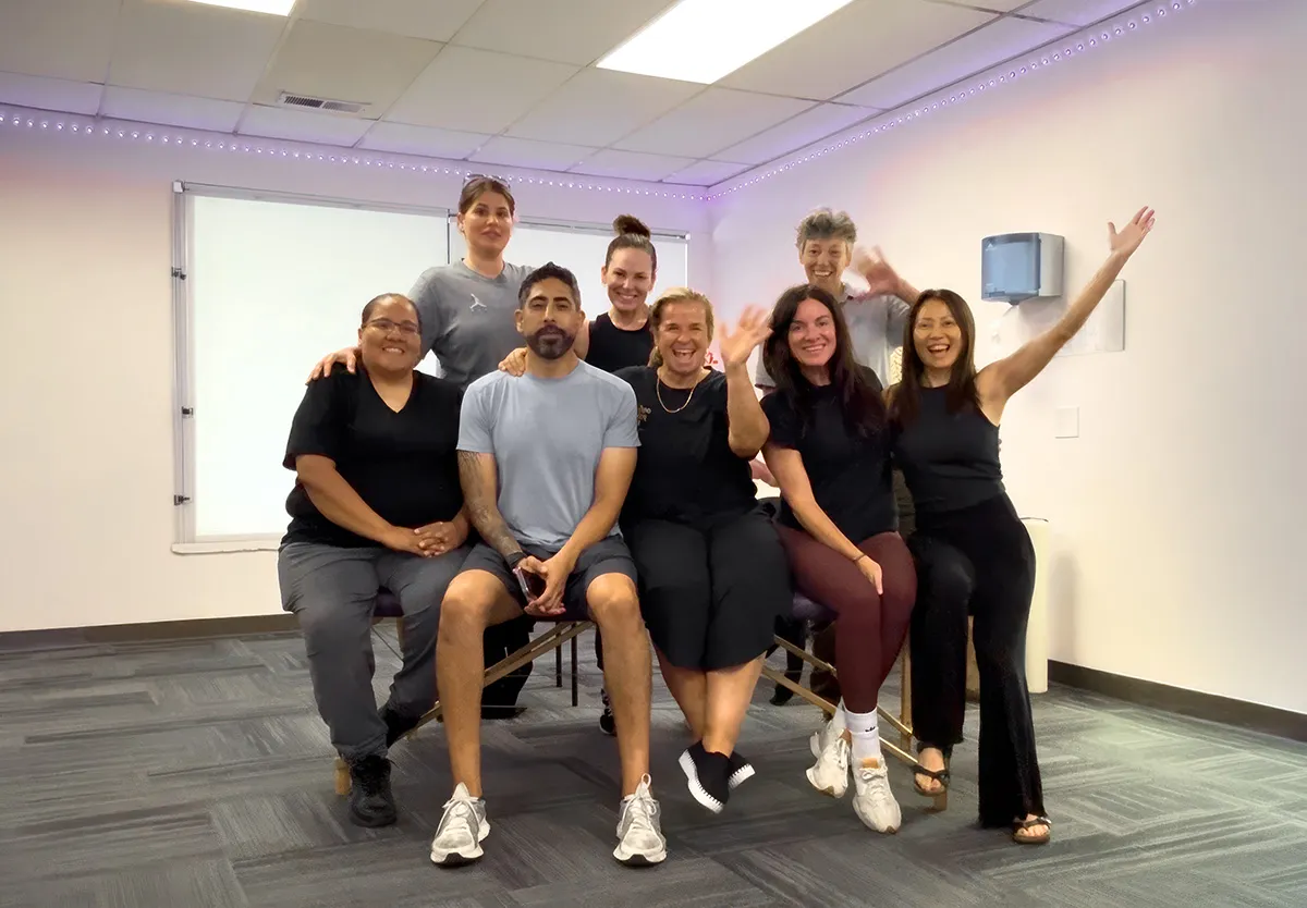 Yodi Richeson with a group of practitioners in her training room